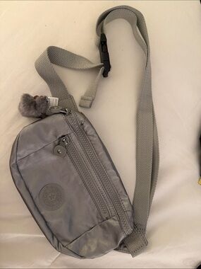 Kipling Metallic Silver Belt Bag with Plush Key Charm